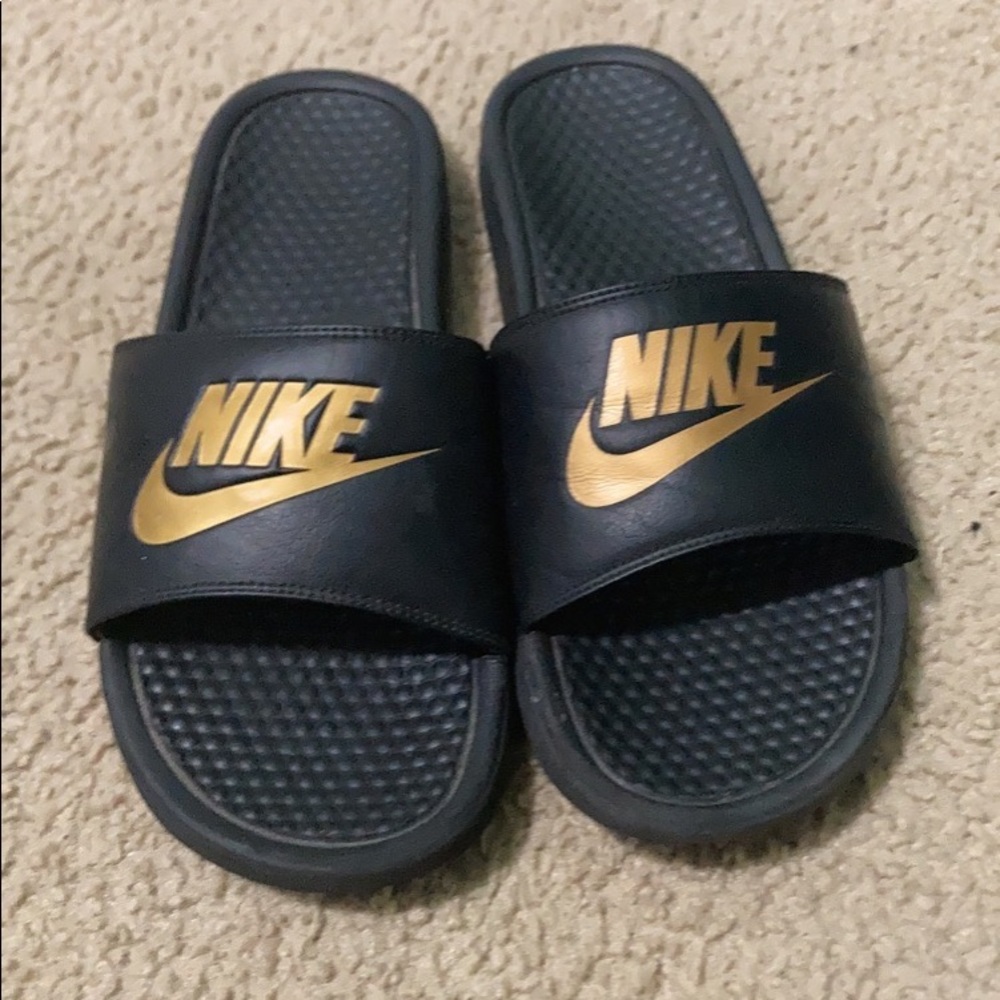 GOLD AND BLACK NIKE SLIDES